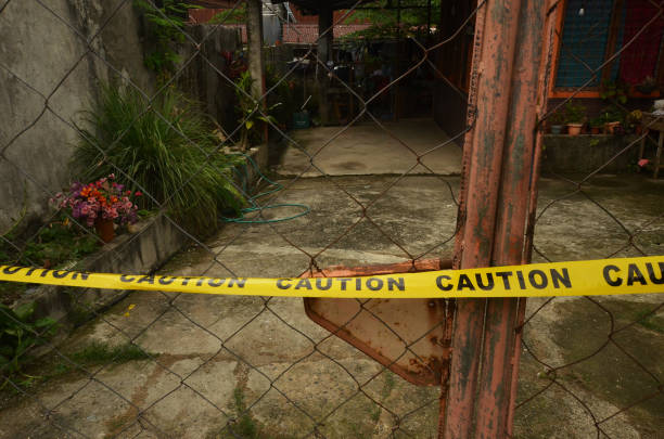 istock Caution tape hanging on the gate photo 1367511566