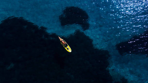 istock Stand up paddling made from above 1367514398