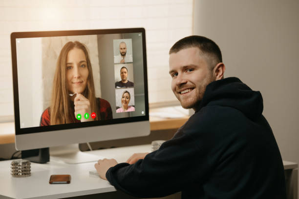 istock A back view of a man during a video call with his colleagues on the computer. 1367516850