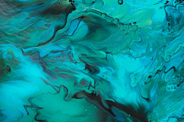 istock Fluid Art. Green and blue abstract wave swirls on black background. Marble effect background or texture 1367522826