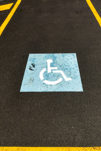 istock Disability symbol painted in a car parking space for disabled people 1367525134