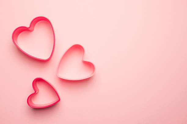 istock Heart shape on a pastel pink background. 1367527548