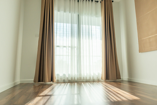 Curtain window interior decoration in living room on sunny day with sunlight