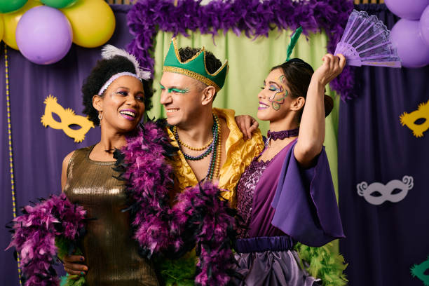 Happy multiracial people in carnival costumes having fun on Mardi Gras party. Cheerful friends celebrating Mardi Gras and having fun together on carnival party. carnival mask women party stock pictures, royalty-free photos & images