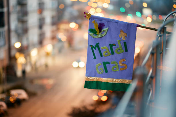 Mardi Gras flag on a balcony. Mardi Gras flag on a terrace during the carnival. new orleans mardi gras stock pictures, royalty-free photos & images
