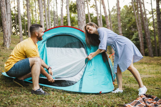 istock Campers setting up the tent at the forest 1367529879