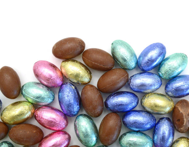 istock Chocolate easter eggs in colorful foil on white background 1367531122