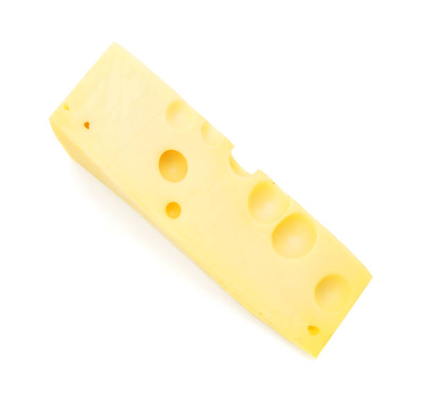 istock Cubes of cheddar cheese isolated on white 1367531414