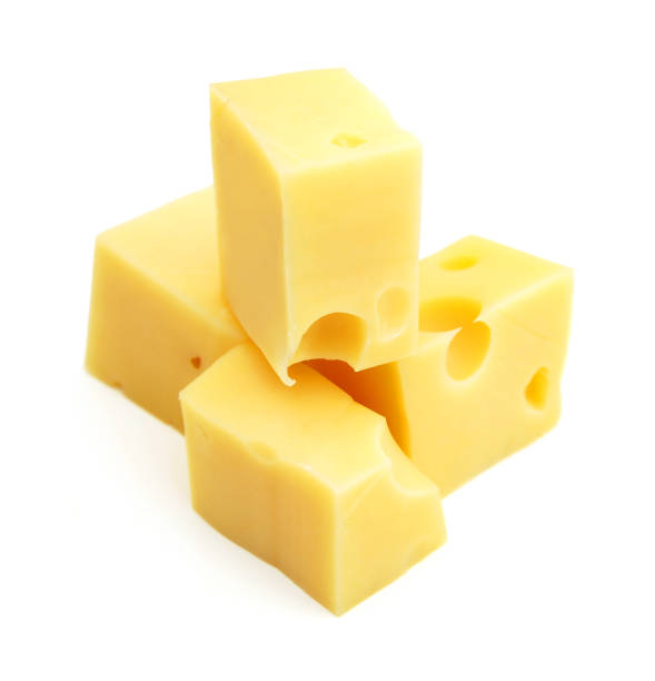 istock Cubes of cheddar cheese isolated on white 1367531422