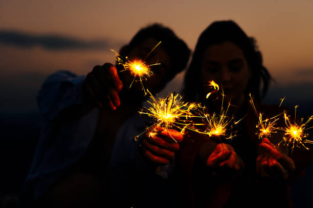istock Evening fireworks on mountain with two people 1367531693