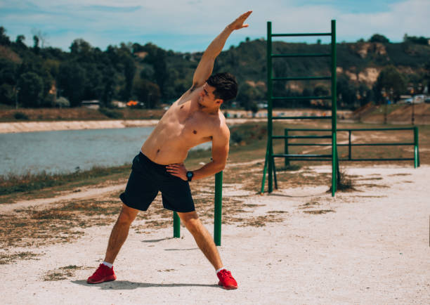 istock Young proud shirtless man having a very hard workout 1367532346