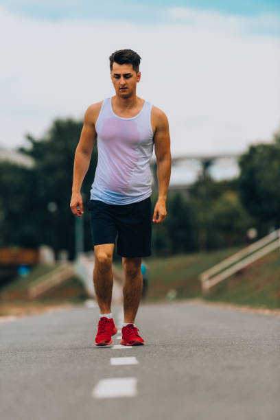 istock Sportive man training jogging outdoors 1367532631