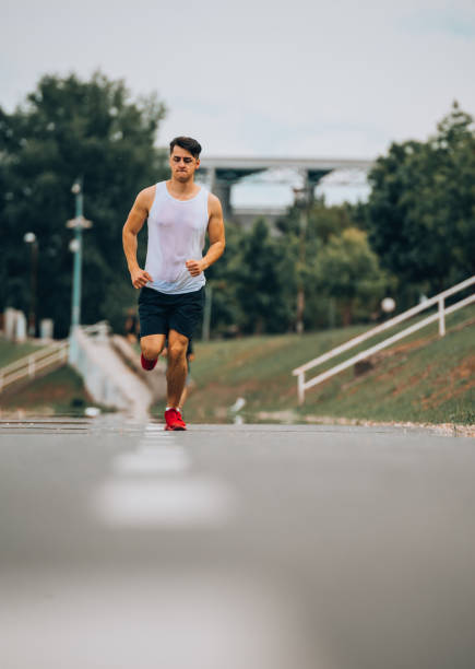 istock Sportive man training jogging outdoors 1367532634