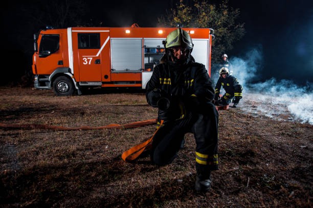 istock Fire brigade in action at night time 1367533917