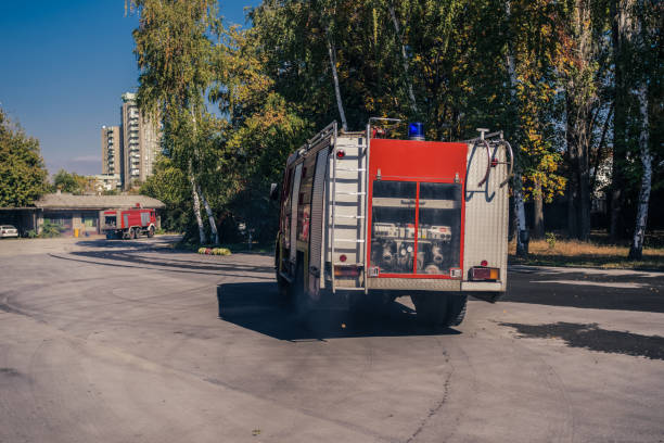 Firefighter in a fire truck; all logos removed. Slovenia, Europe. Nikon.