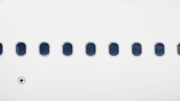 windows on fuselage of airplane - airplane porthole imagens e fotografias de stock