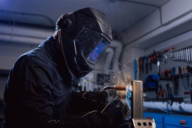 istock Welder with protection mask. Stock photo. 1367537610