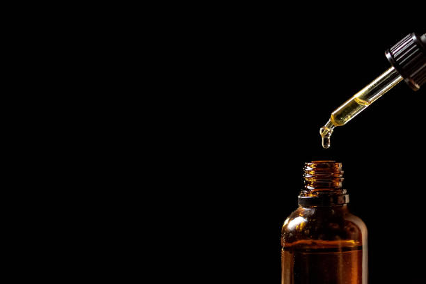 CBD hemp oil in pipette stock photo
