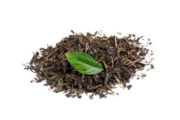 istock Dried green tea on the white background 1367538651