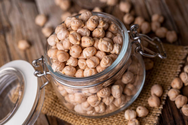 istock Dried raw chickpea on the wooden background 1367538766