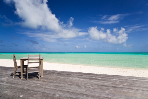Table and chairs at paradise beach, Maldives