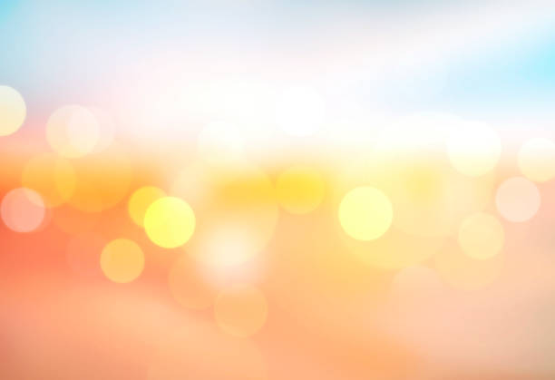 istock Sunset blurred background, sunshine holiday vocations background.Orange blue glowing texture. 1367540237