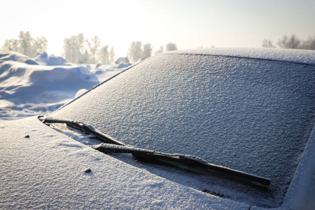 istock Snow covered car windshield close-up. Winter. Season specific. Outdoors. Selective focus 1367541220