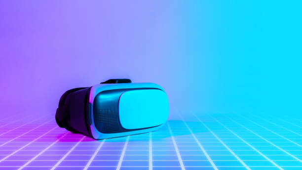 istock Virtual reality headset VR. 3d digital glasses on futuristic neon tech background. VR future gadgets technology, education online, studying, video game concept. 1367542397