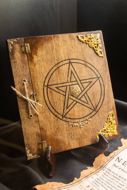 istock Old book of black magic. Concept for mystery, fantasy, evil 1367542421