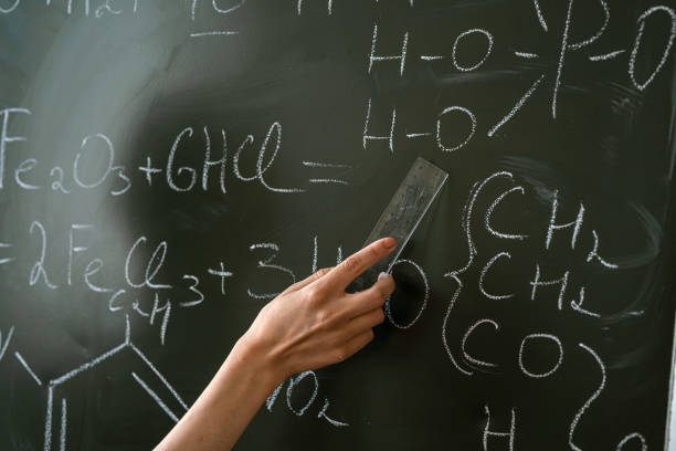 istock chemistry teacher writing and explain chemical formula on class board 1367544927