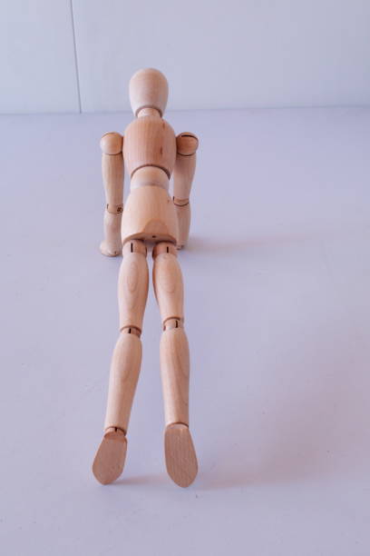 istock Wooden figure as a model for exercising at home 1367546689