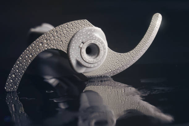 istock Modern technologically advanced rotary knife blade. Hand blender attachment in water droplets. Focus stacking. Close-up 1367546838