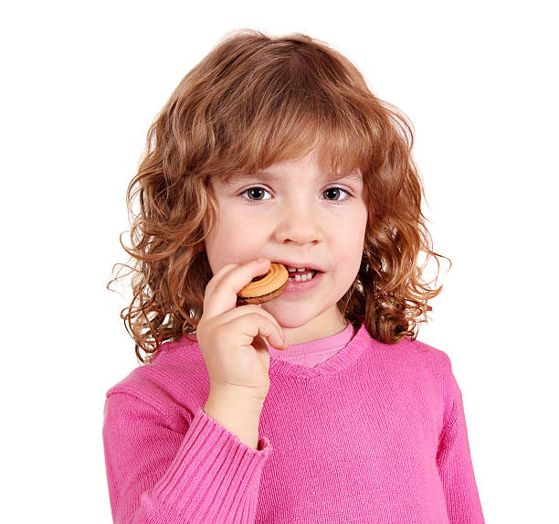 istock little girl eat cake 136754772