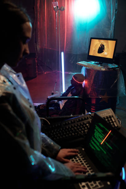istock Young female typing on computer against African male cyberpunk 1367549855