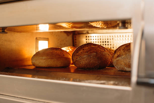 istock Bread is baked in the oven. Bakery concept. 1367549953