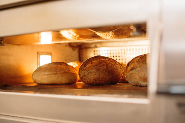 istock Bread is baked in the oven. Bakery concept. 1367549954