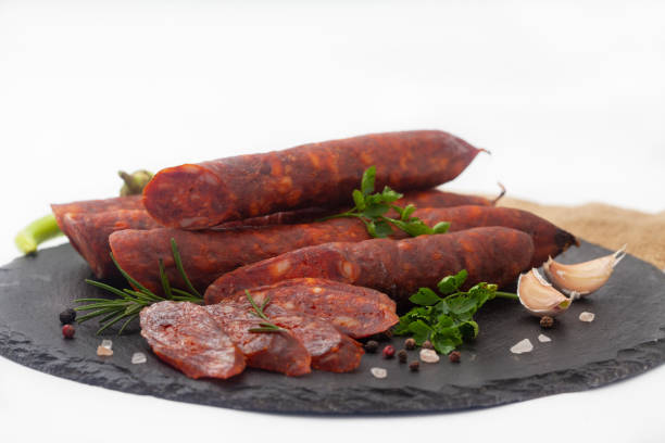 istock Smoked, homemade sausage on white background 1367549957