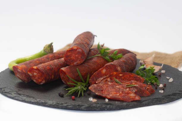 istock Smoked, homemade sausage on white background 1367549959