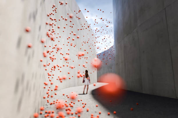 Woman standing in abstract concrete corridor