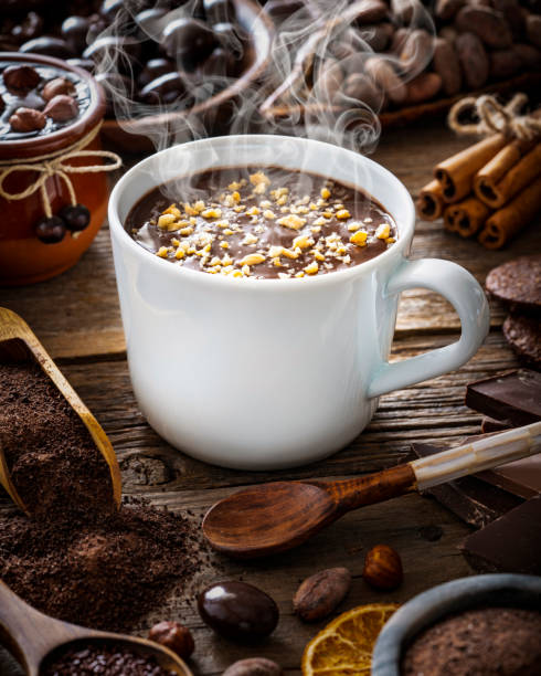 istock Melted hot chocolate cup and cocoa beans and pod with assorted chocolate 1367551304
