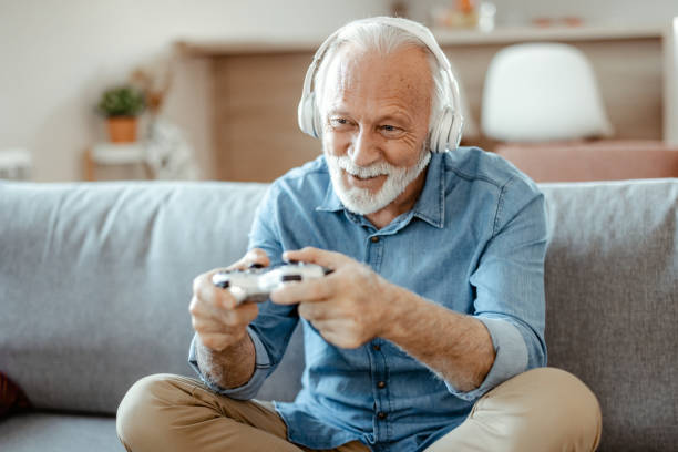 istock Senior Man Piaying Video Games 1367551384