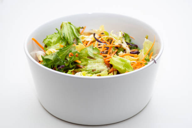 istock mediterranean salad in a bowl isolated on white background 1367554615