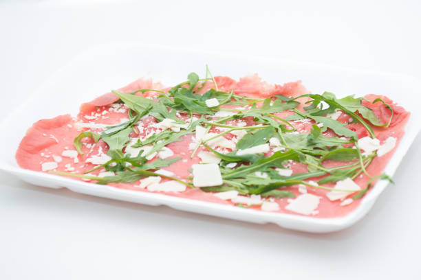 Salad of smoked salmon, rocket, tomato, onion and spring onion.