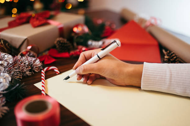 istock Writing down Christmas wishes 1367556656