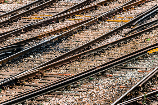 Railway tracks merging into one track in the winter rural countryside