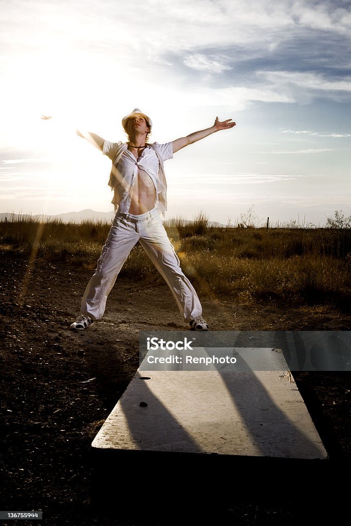 Goal Accomplished Man standing in front of a door laying on the ground with his arms up in the air. Men Stock Photo