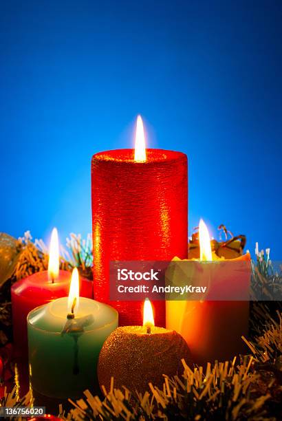 Five Burning Colourful Candles Against Blue Background Stock Photo - Download Image Now