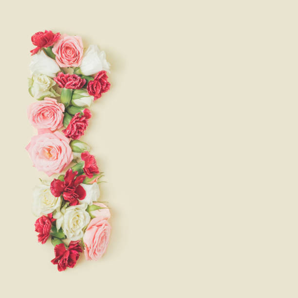 istock Spring flowers arranged against the pastel yellow background. 1367560249