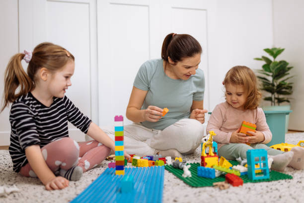 istock Mother and daughters playing and enjoying time together 1367563159