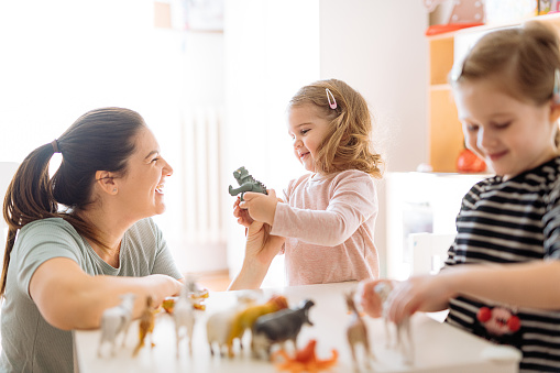 Mother and daughters playing and enjoying time together